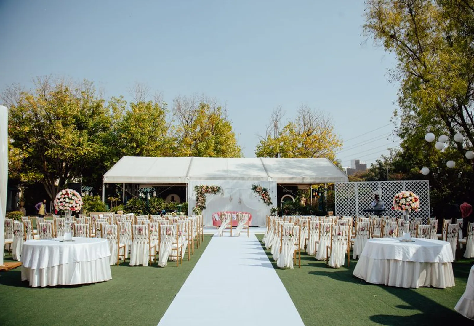 The open floor under the tent, tables cleared to the edges