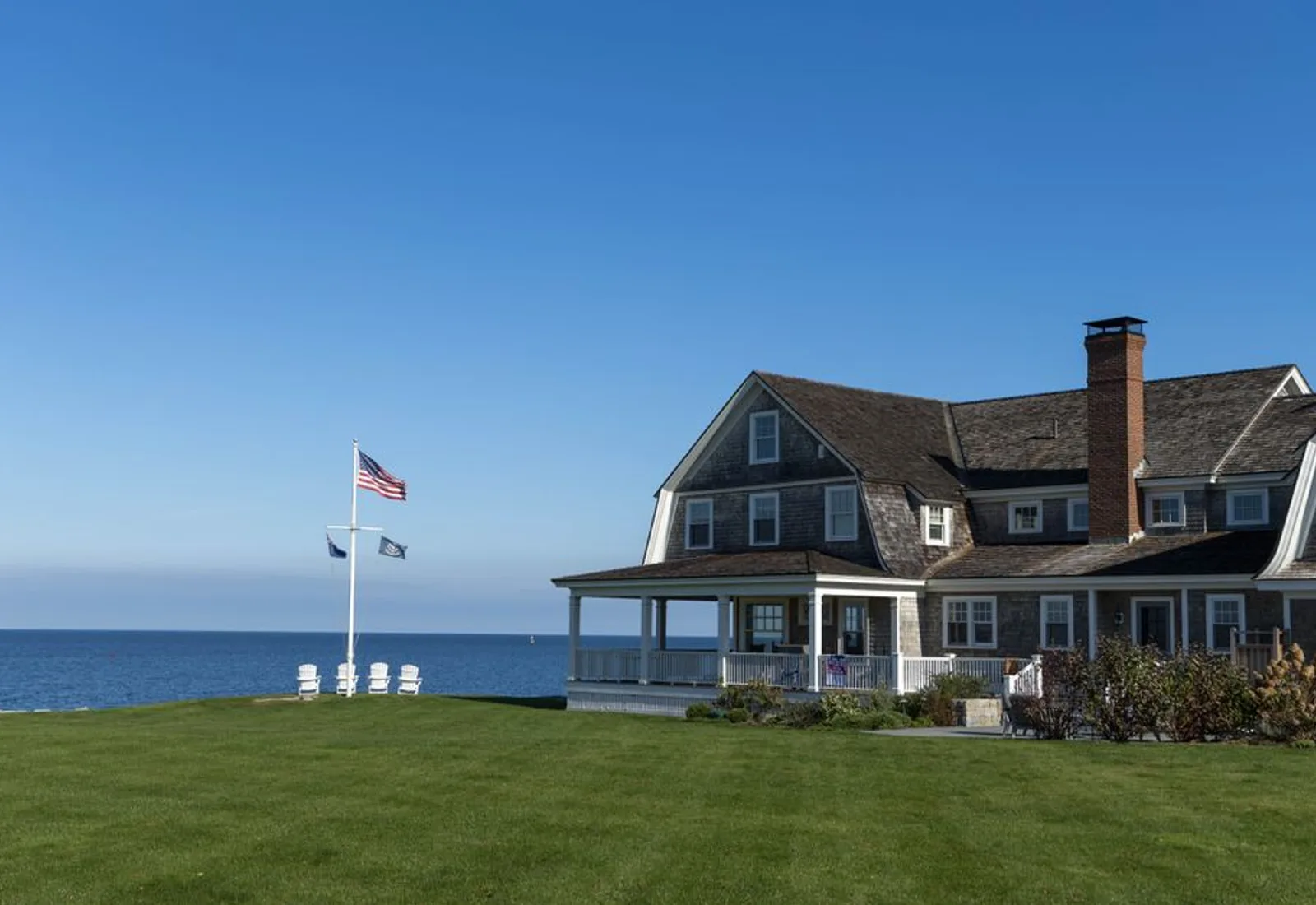 The porch of the house looking out across the lawn to the water