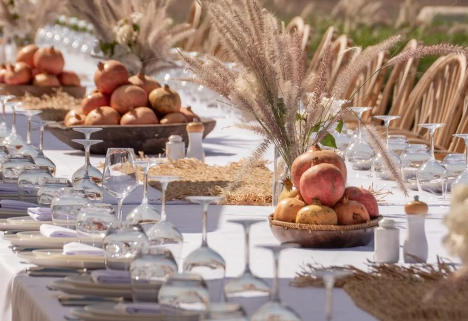 A close view of the table — linen, glassware and low florals