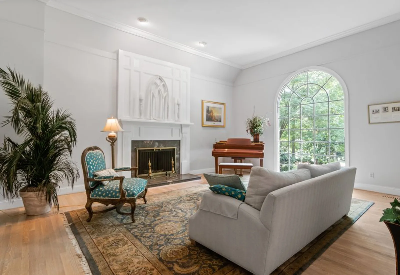The parlor set for an intimate dinner, fireplace at one end